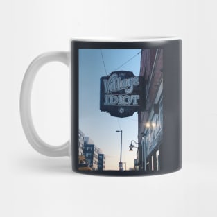 The Village Idiot bar sign Mug